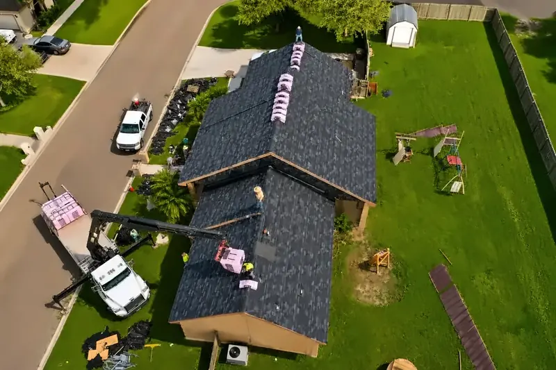 Texas Contractors, Inc. crew loading shingles onto a new roof in the Rio Grande Valley