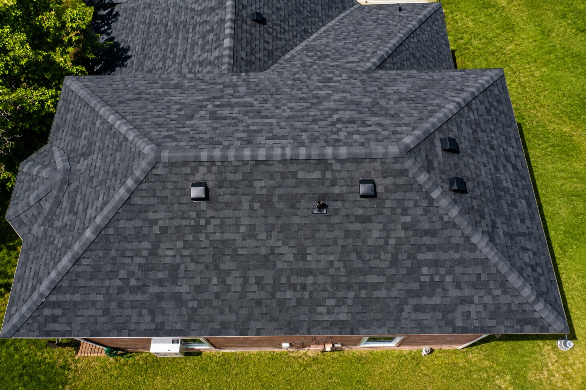Drone view of the completed charcoal architectural shingle roof replacement in Mission, Texas